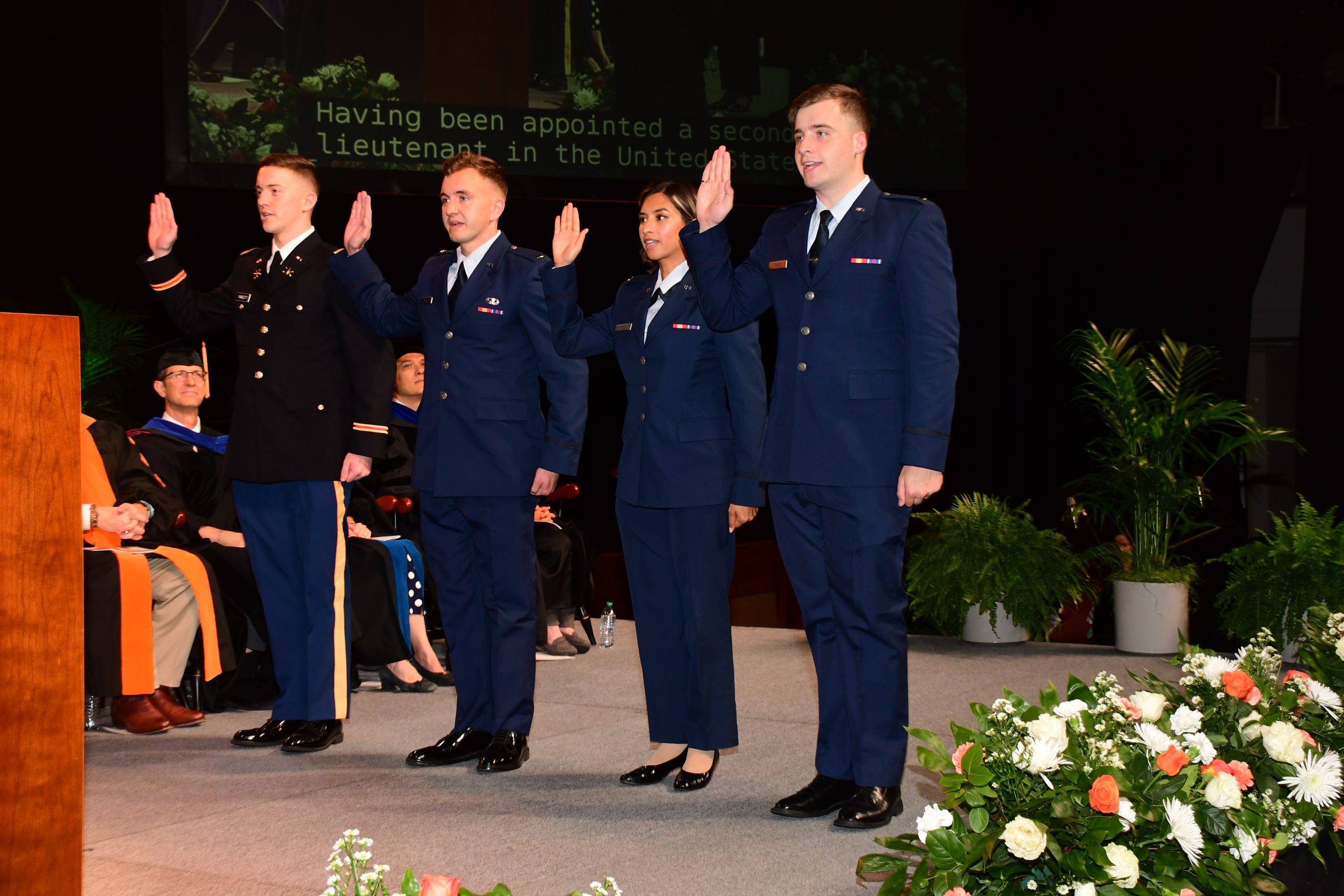 Graduates from the Tickle College of Engineering are sworn in to the military during the commencement ceremony.