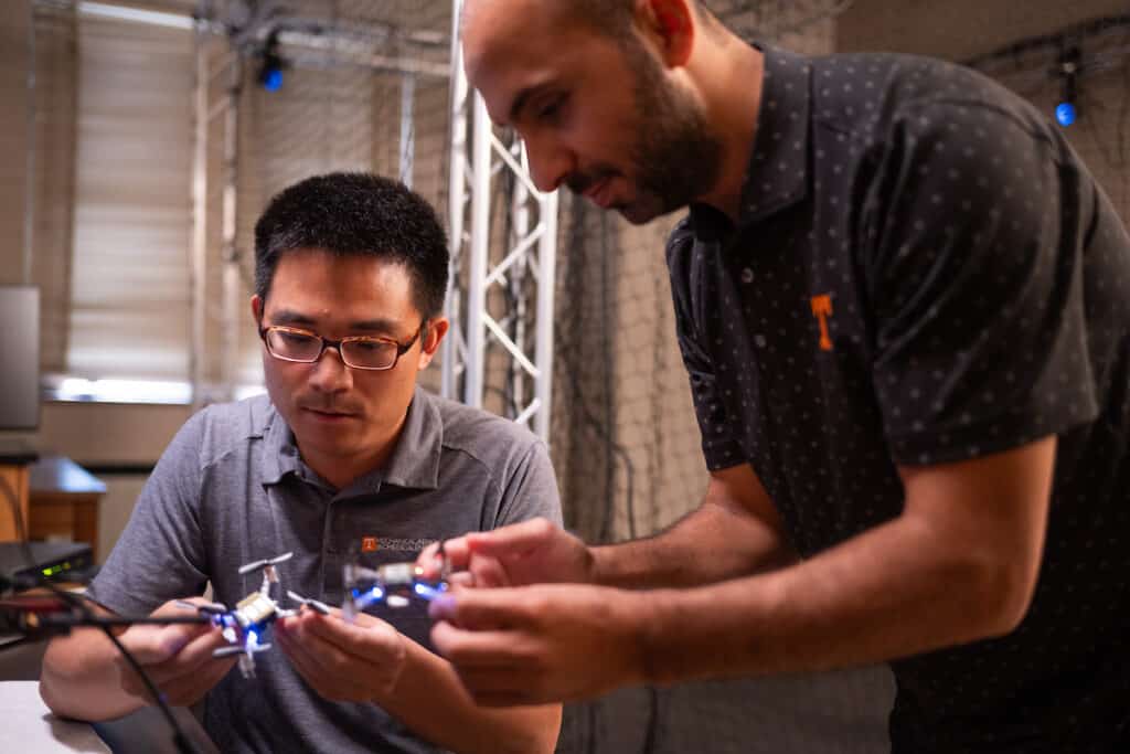 Assistant Professor Zhenbo Wang explains nano drone research to PhD student Sabrullah Deniz in the Autonomous Systems Laboratory in the Nathan W. Dougherty Engineering Building on August 09, 2023. Photo by Jennie Andrews/Freelance Photographer/University of Tennessee. UTK UTK