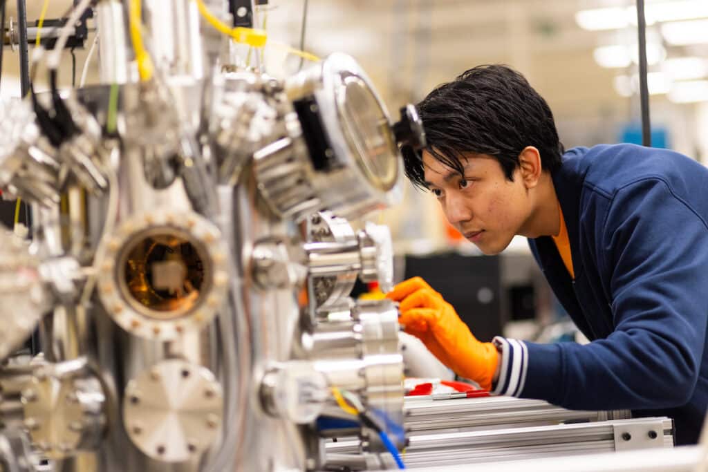 Munireach Nannory, 1st year masters student, Civil and Structural Engineering, prepares to test materials samples using a 3MV tandem accelerator with multiple beamlines and stations in the Ion Beam Materials Laboratory (IBML) inside Senter Hall