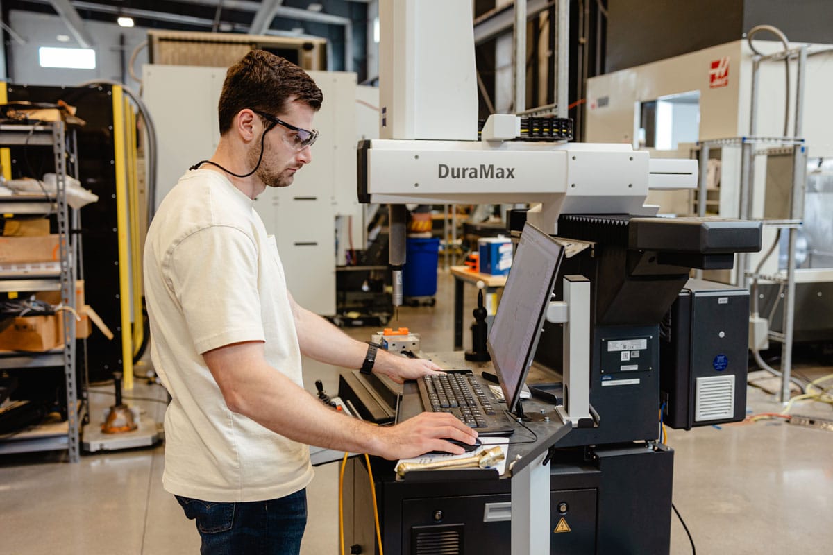Grad student working with the TN-Made equipment