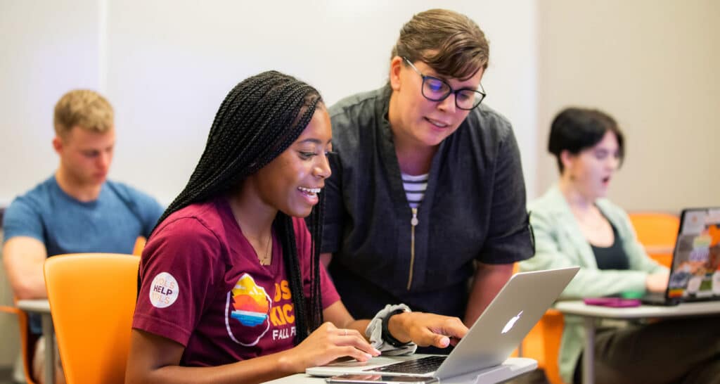 Advisor working with student