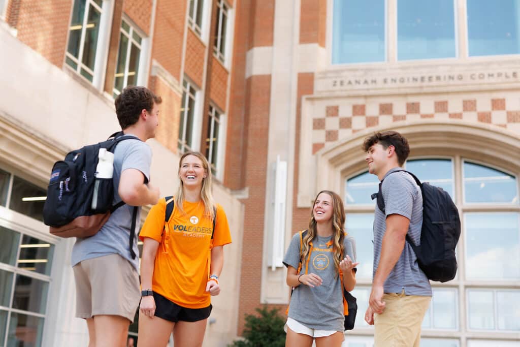 Lady Vol soccer player Ally Zazzara vistis with friends during an “It take a Volunteer” produced student lifestyle photoshoot outside the Zeanah Engineering Complex on August 29, 2024. Photo by Steven Bridges/University of Tennessee.
