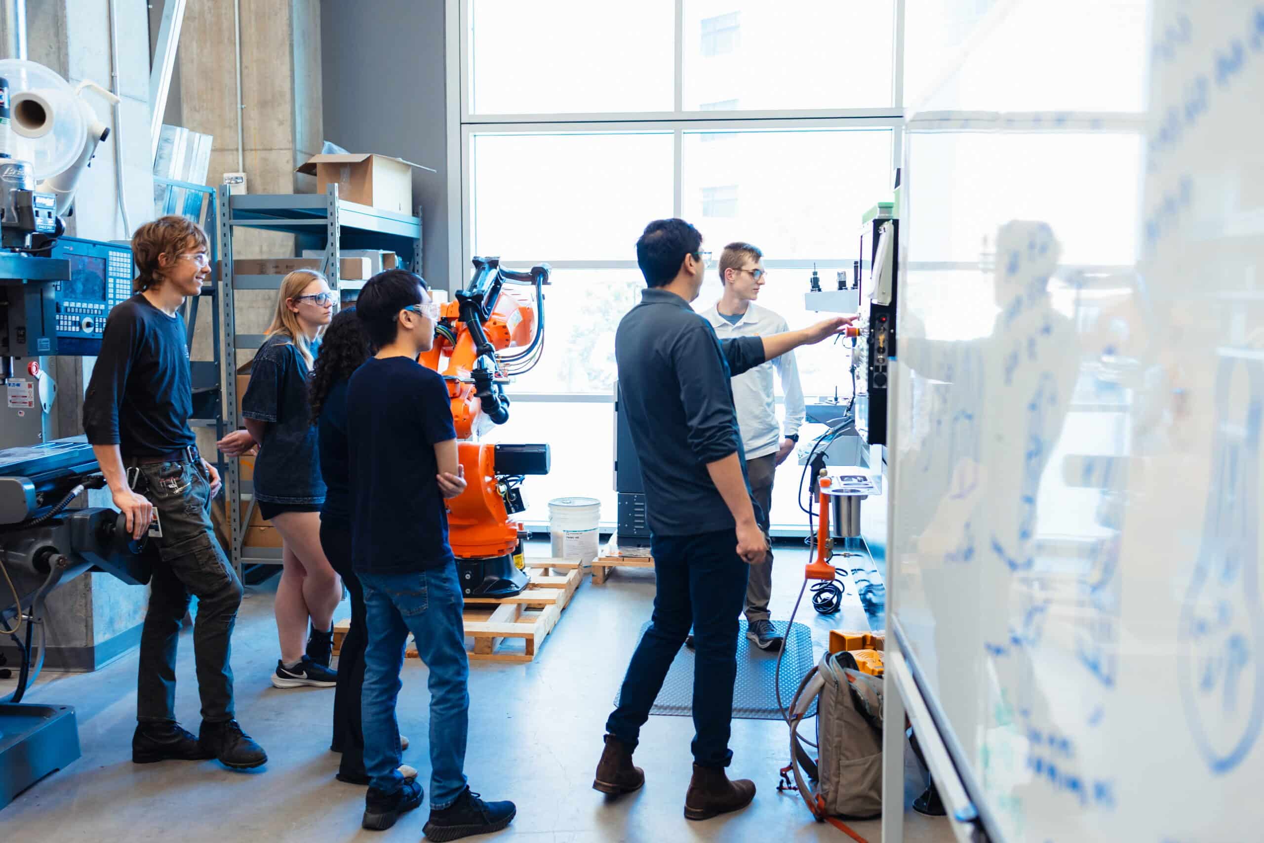 Applied Engineering Assistant Professor of practice Jose Nazario Moreno demonstrating a machine to students