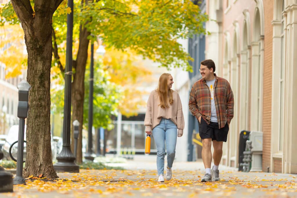 Trisha Forrester walks with Josh Boshers through Downtown Knoxville while creating local student lifestyle