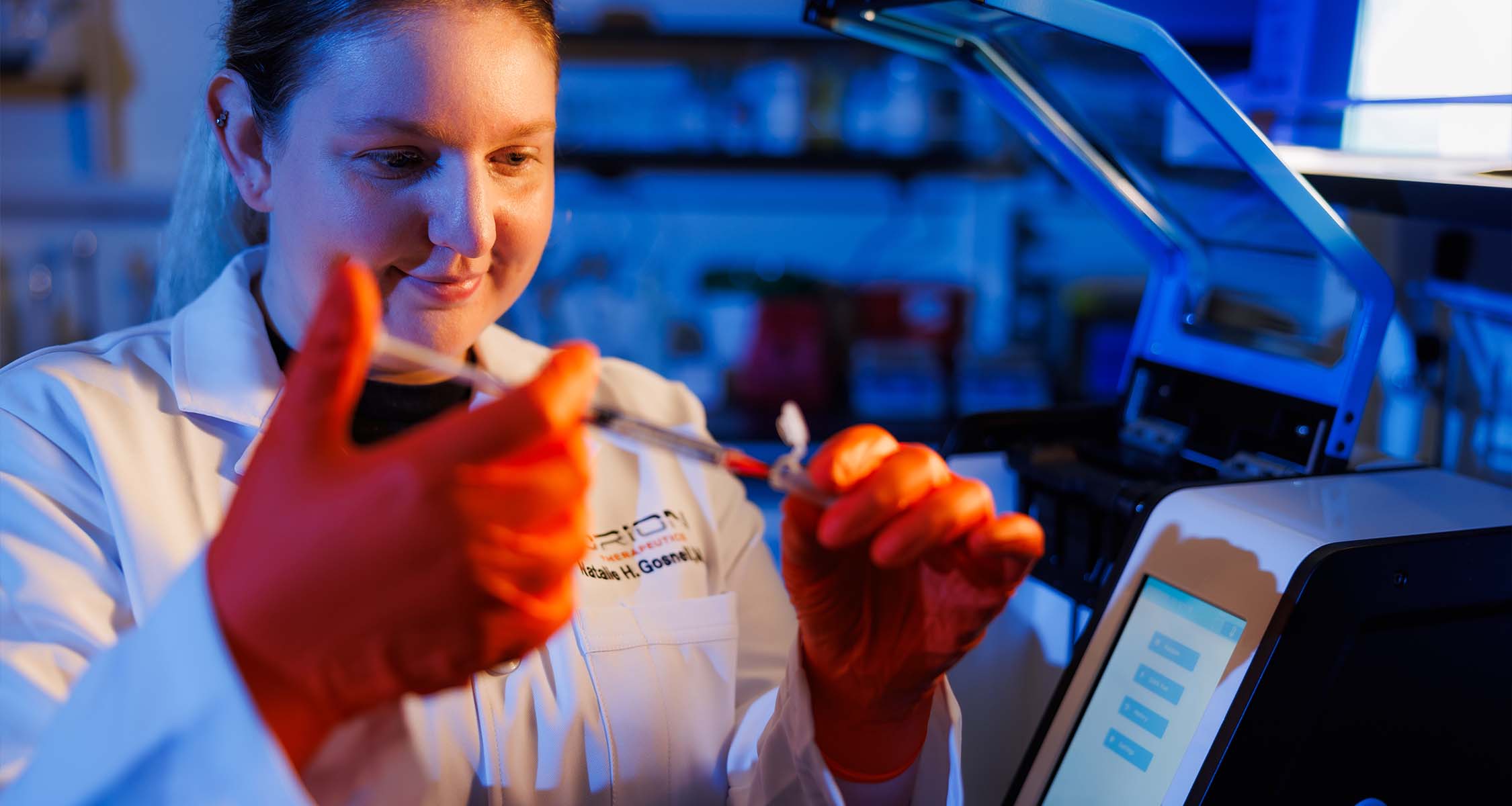 Alumna Natalie Gosnell (BS biomedical engineering ’19, MBA ’23) works in an Orion Therapeutics pharmaceuticals lab in the Institute for Advanced Materials and Manufacturing