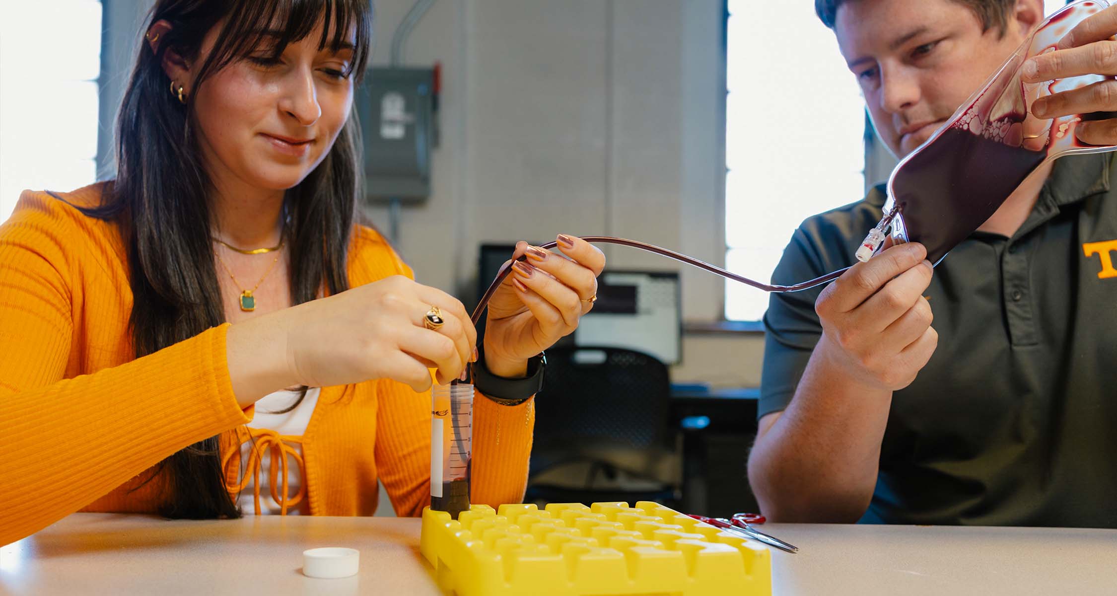 Bryan Good works with graduate student in Dougherty Engineering Lab