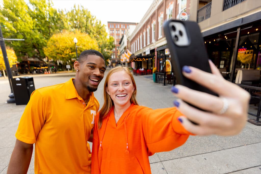 Two students walk through downtown Knoxville