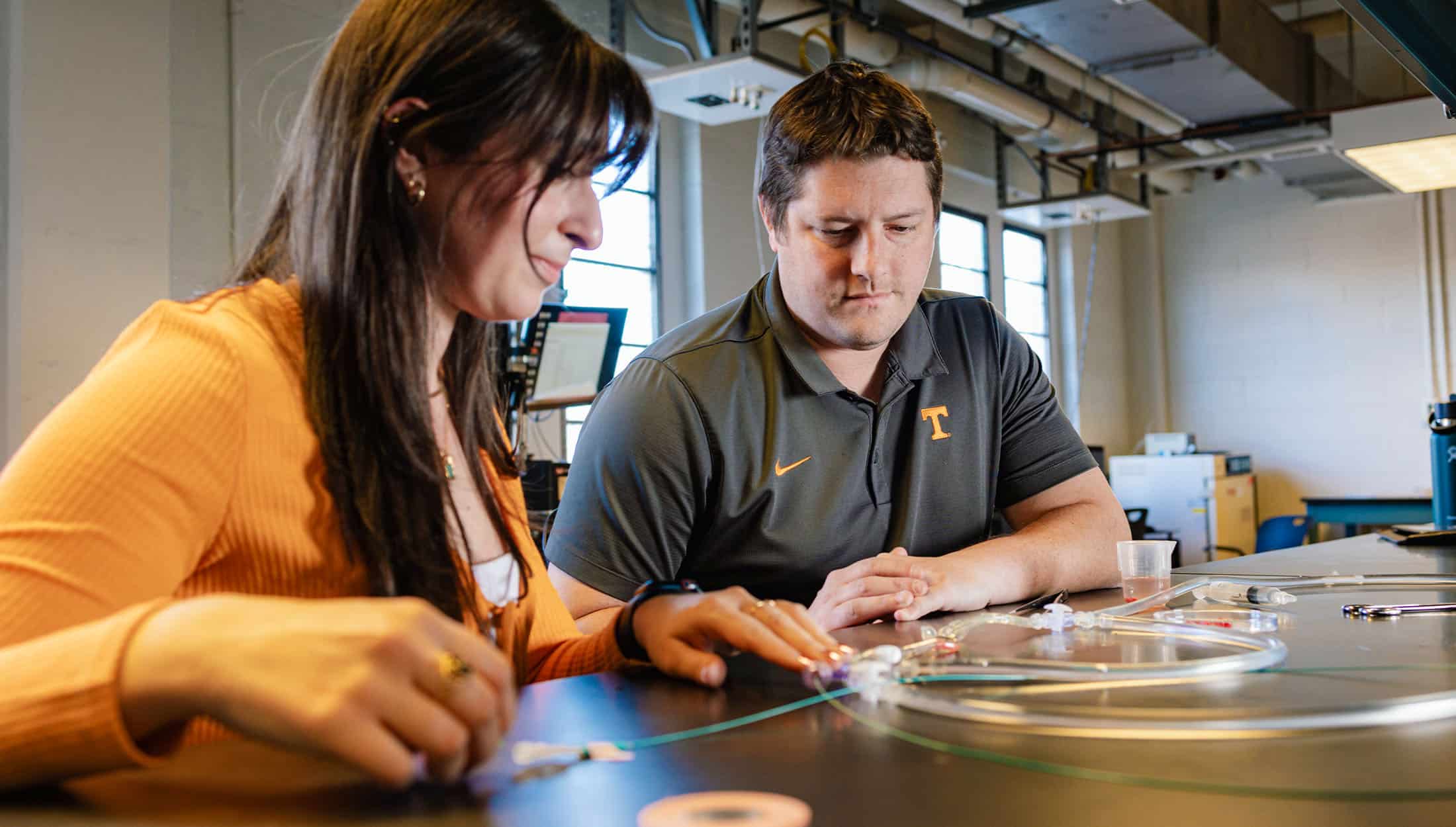 Brian Good working with Demi Poulos in a Dougherty Engineering Building lab. 