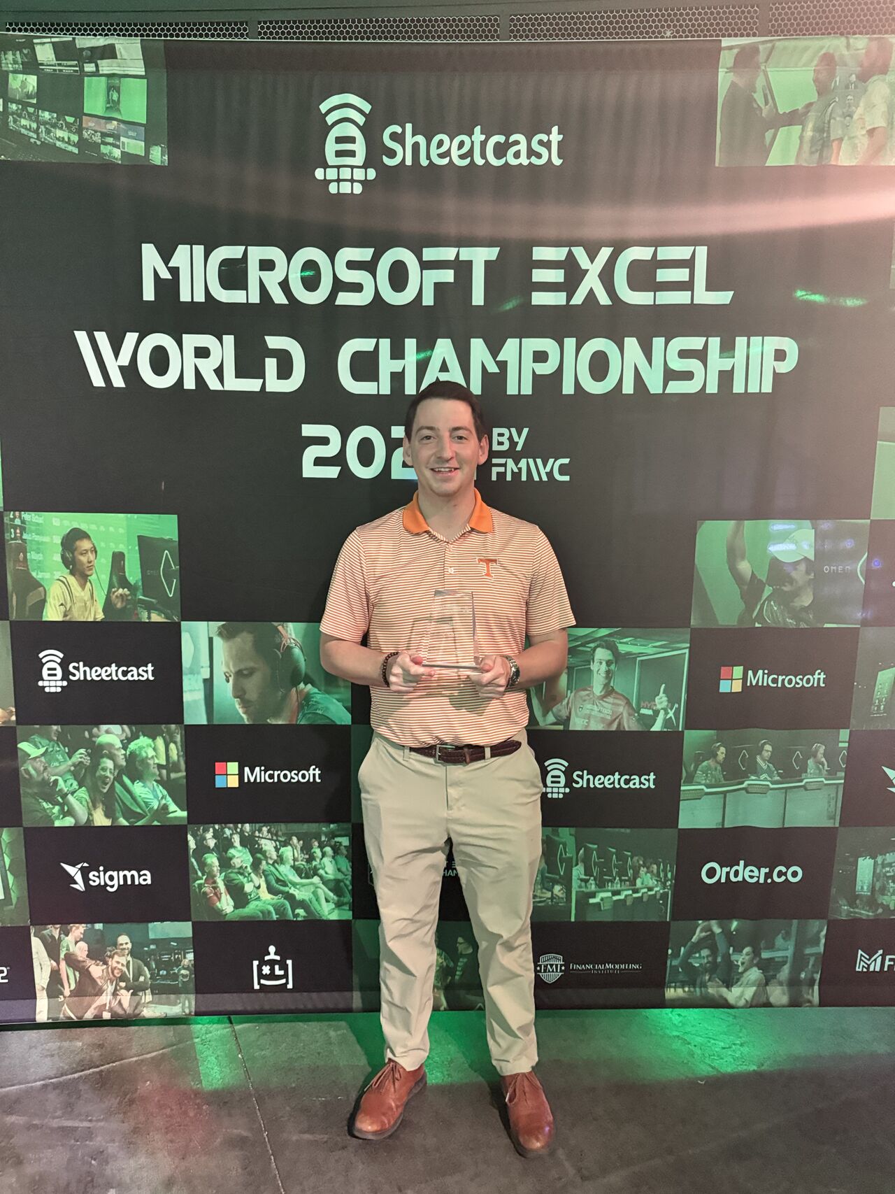 Ben Northern poses with his prize at the 2024 Microsoft Excel Collegiate Challenge.