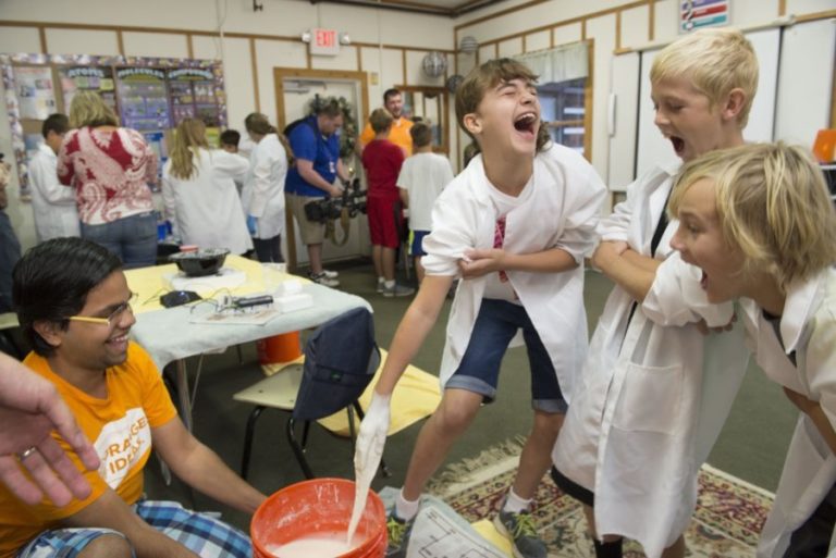 students at Tate's school enjoying experiments