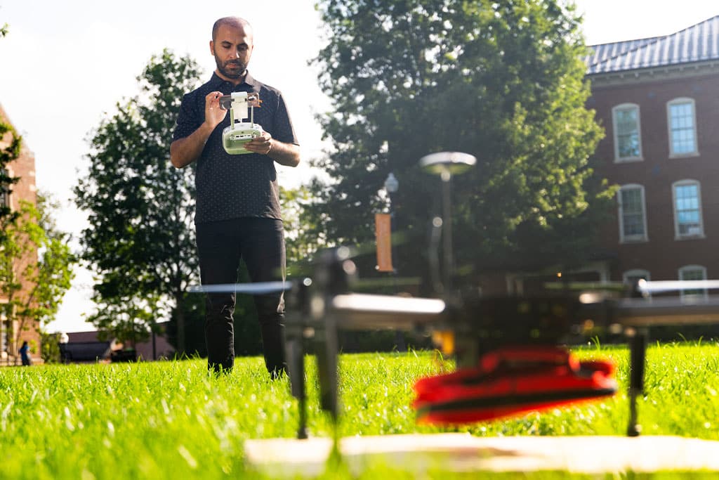Student uses drone Ayres Hall courtyard
