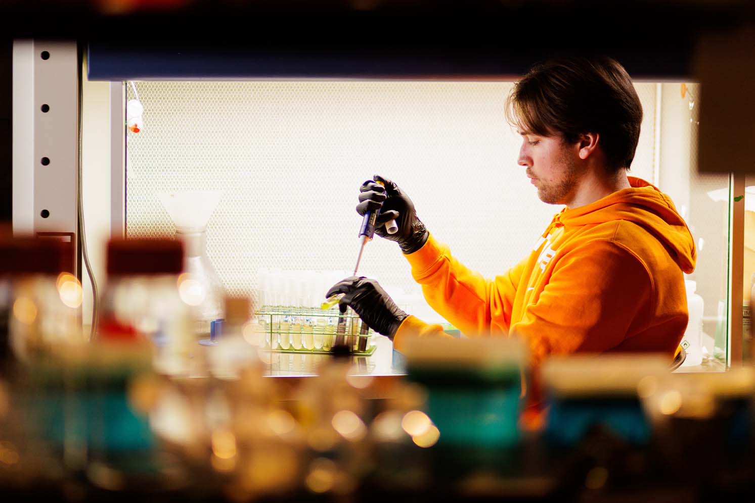 Student works with chemicals inside SERF lab