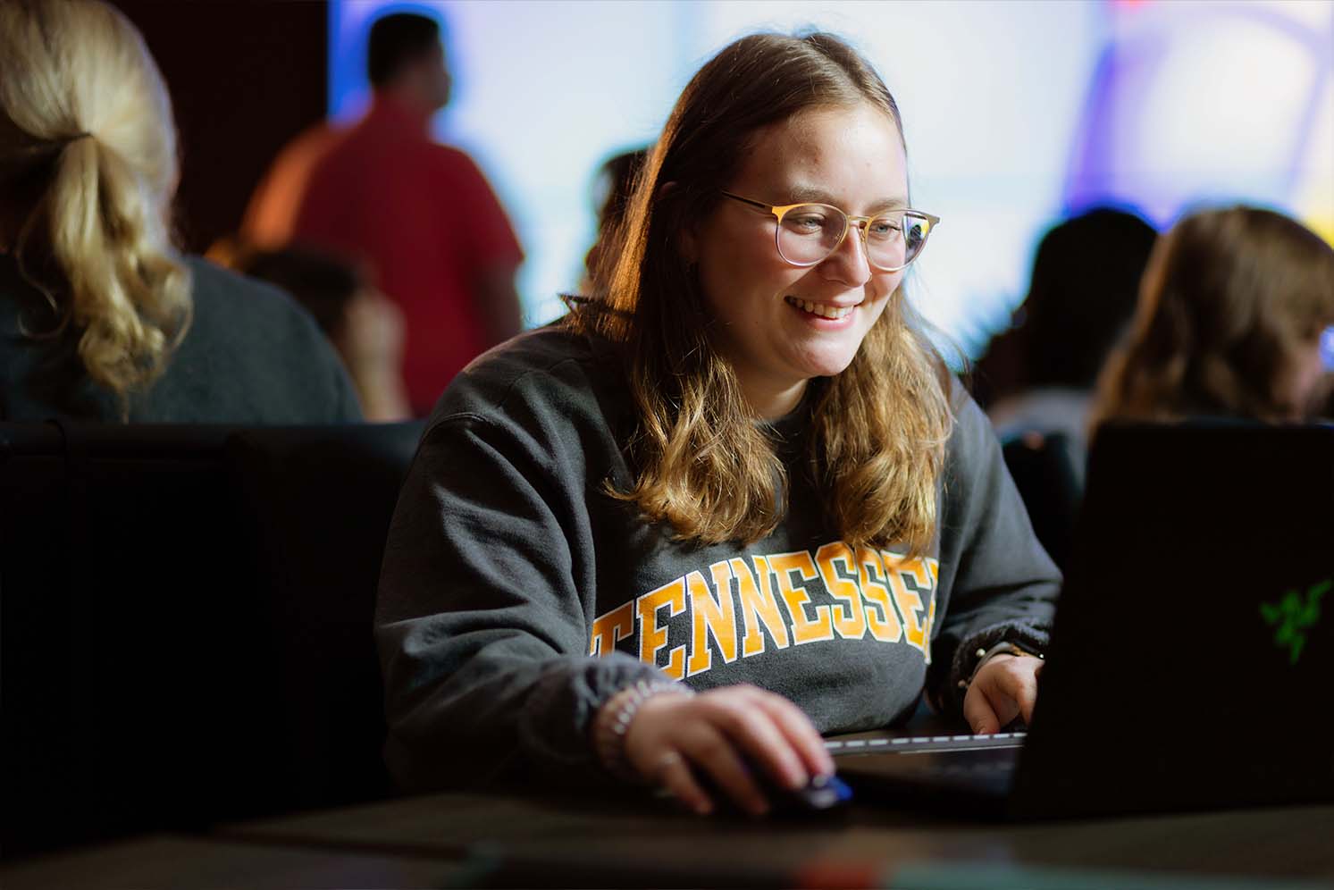 Student working on computer inside Visualization Lab
