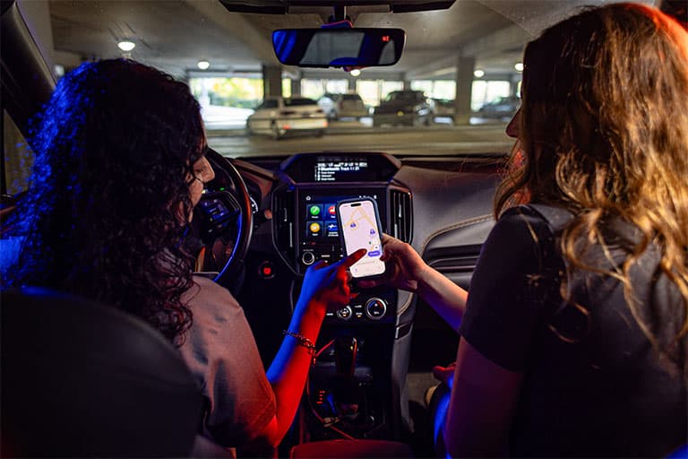 students using the VolPark app in their car