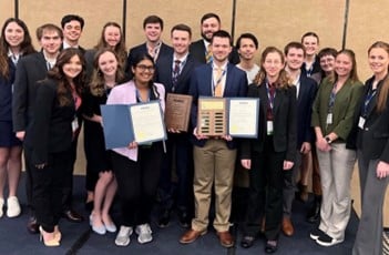 Sreya Kumpatla, Mason Roddy, Chad Bolding, and Jamison Murphree hold the awards they received at the AIAA Student Conference.