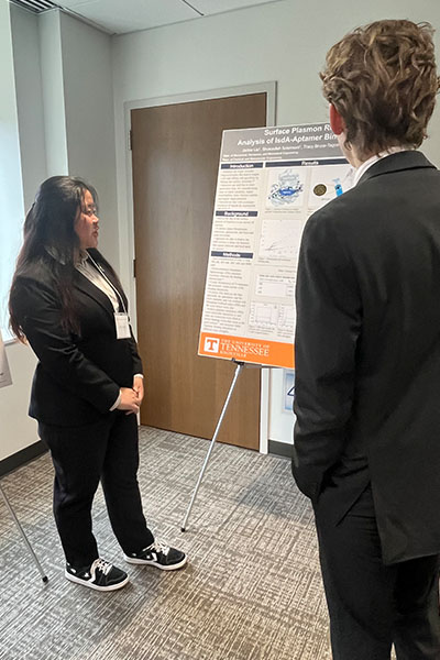 Jackie Liu and Jai Mehta present their posters at the Capitol event.
