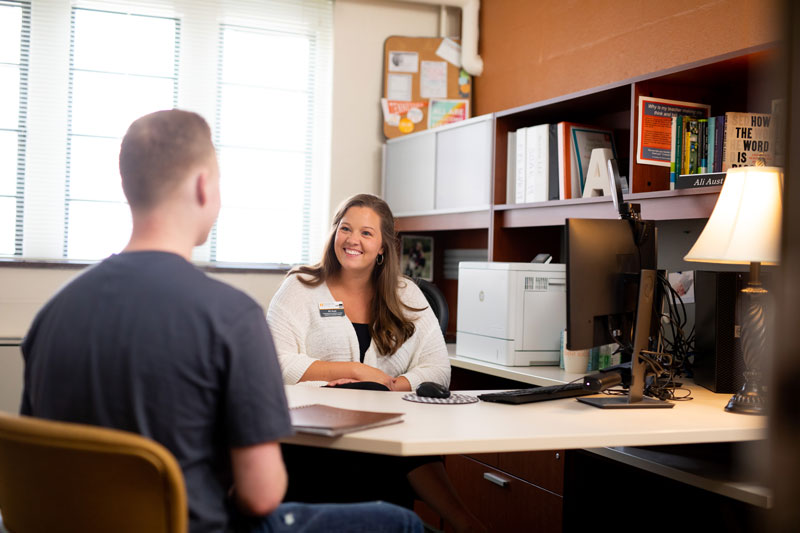 Staged advising photoshoot for Student Success in the Greve Hall Academic Success Center