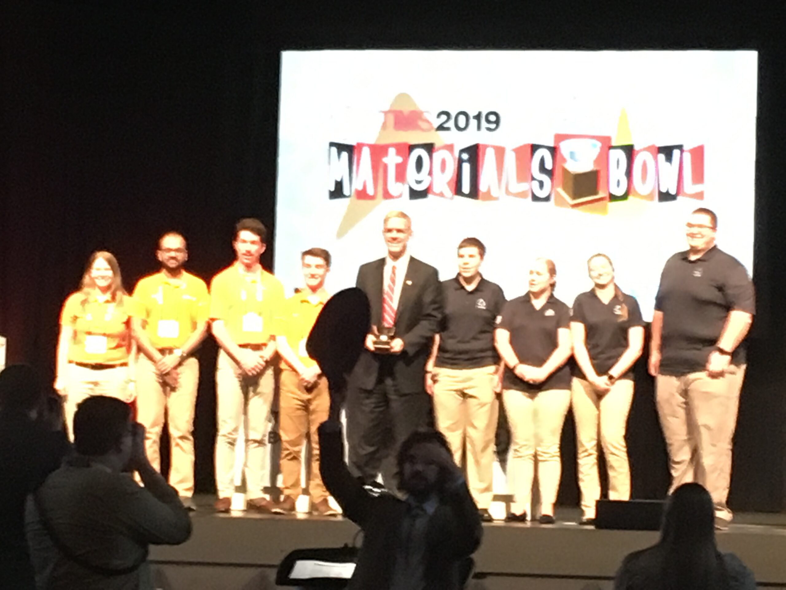 The MSE group of Sarah Wonner, Rakesh Kamath, Eli Darby and Connor Stephens are presented their award on stage.