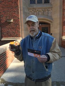 Carl Lundin holding a 50th anniversary award.