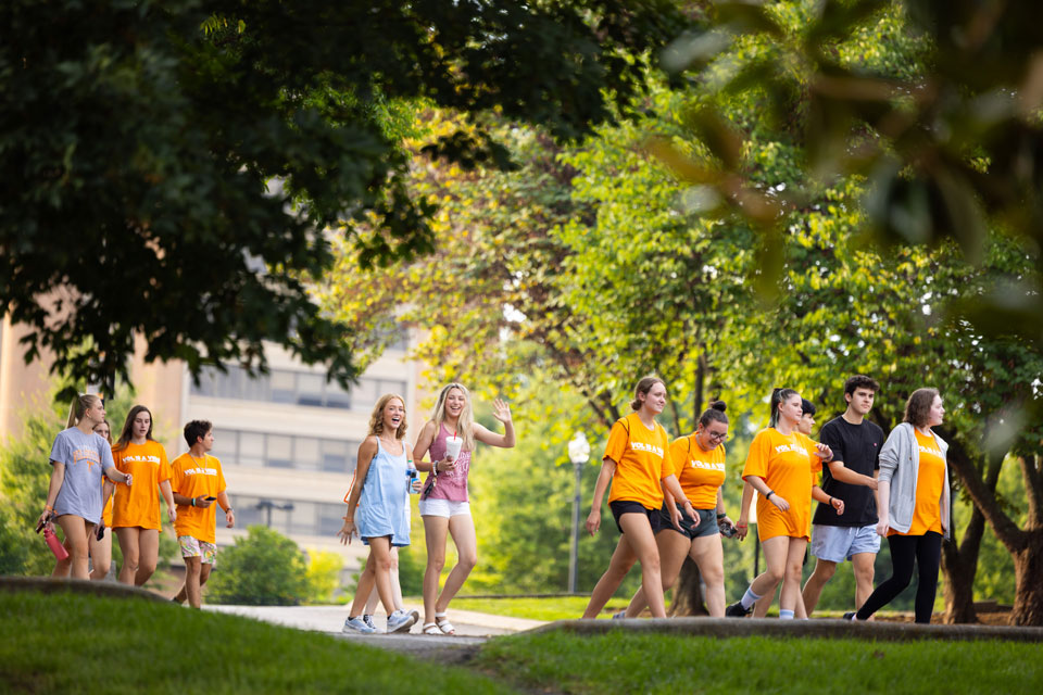 Students walking around campus in a group