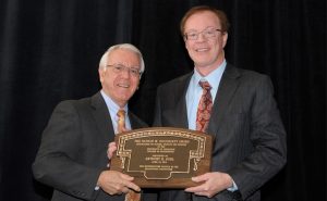 Dean Davis presents the Dougherty Award to Dr. Tony Buhl