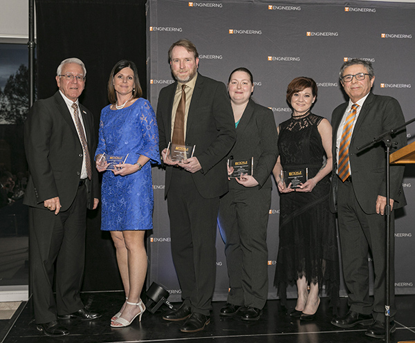 Dean Wayne Davis and Associate Dean Masood Parang, at left and right, presented the 2018 Outstanding Staff Awards. From second left are Kathy Williams, David Rogers, Ashly Perason, and Yvette Gooden.