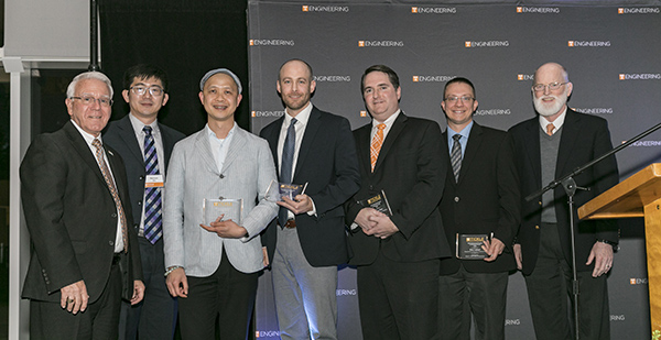 Dean Davis and Associate Dean Dunne presented research awards to, from left, Haixuan Xu, Cong Trinh, Andy Sarles, Garrett Rose, and Eric Lukosi.