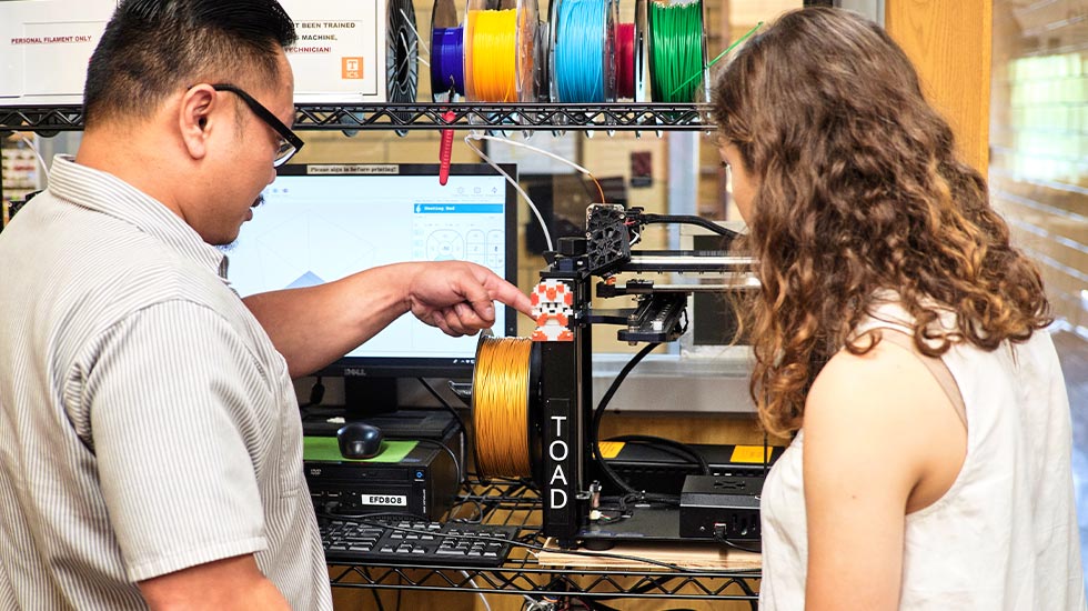 Student using 3D Printer in ICS Lab