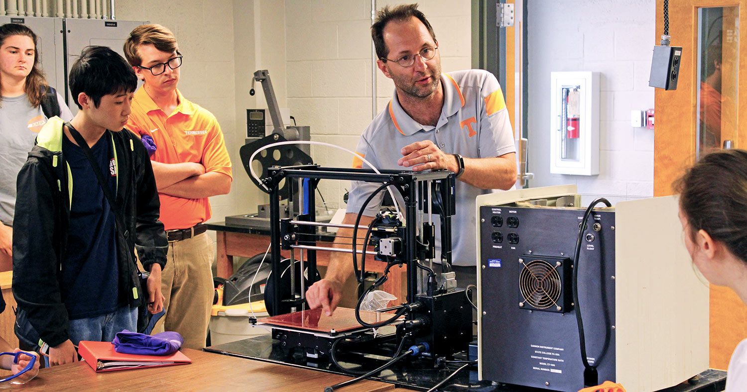 Chris Wetteland shows 3D printing capabilities during a summer camp for visiting STEM students.