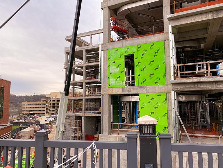 Wall panels start to fill in the structure of the new building in February 2020.