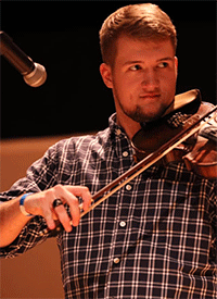 Adam Larkey playing the fiddle