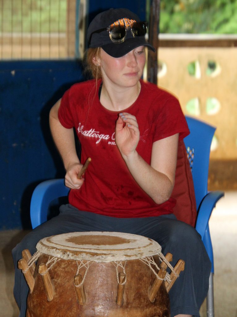 Savannah Davidson plays a drum.