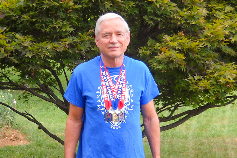 Froula with his medals from the 2016 TN Senior Olympics.