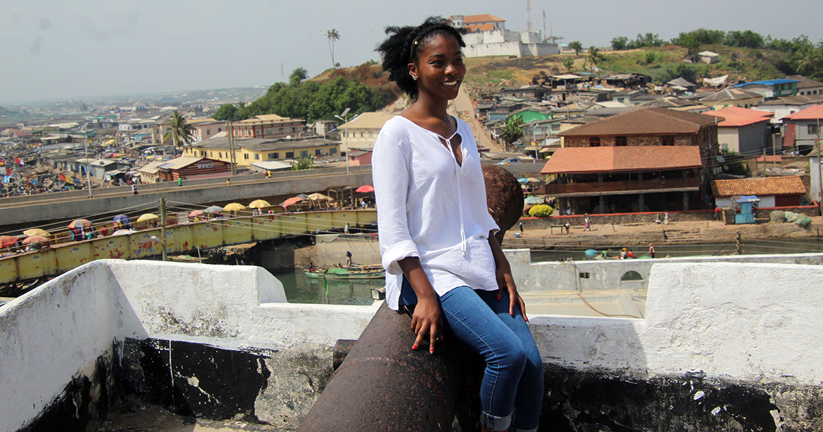 Naydia Futrell-Peoples poses at the top of a building.