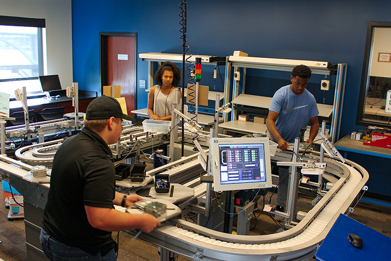HITES12 Students work on the Factory Floor Lab