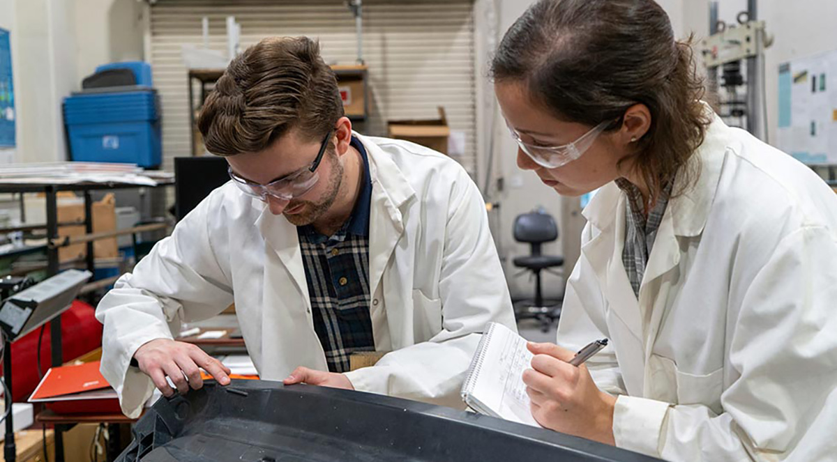 IACMI’s Sean Lee and Tessa Patton work on the composite liftgate created for Volkswagen in their lab at SERF (Science Engineering Research Facility) on the campus of UT Knoxville. December 11, 2019. Photo by Sam Thomas.