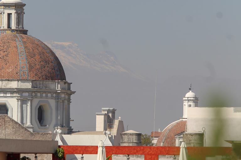 View in Puebla with a snow-covered Volcán Popocatepetl in distance
