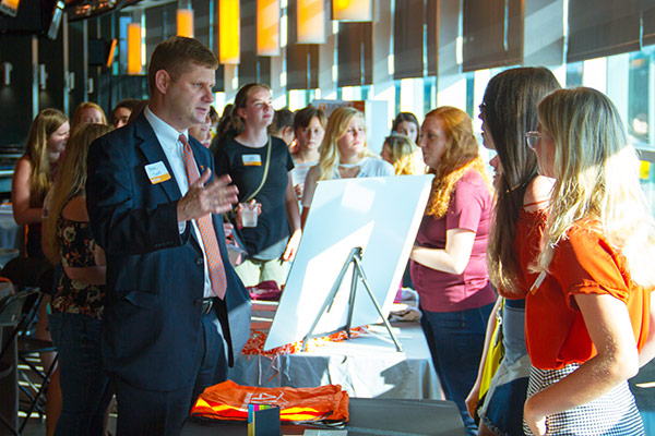 Development Director Brian Shupe, left, chatted with representatives from engineering student groups.