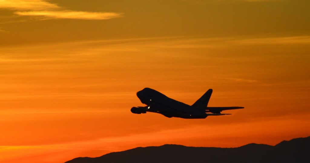 Airplane Taking Off During Sunset
