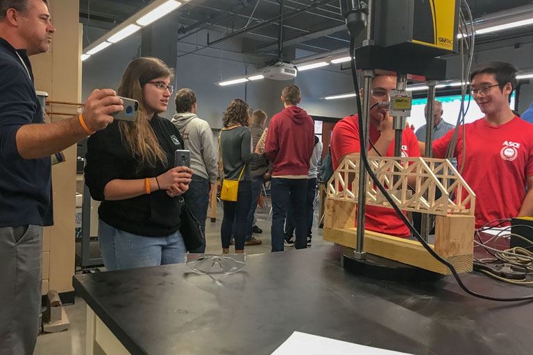 Students Test their Balsa Wood Bridge