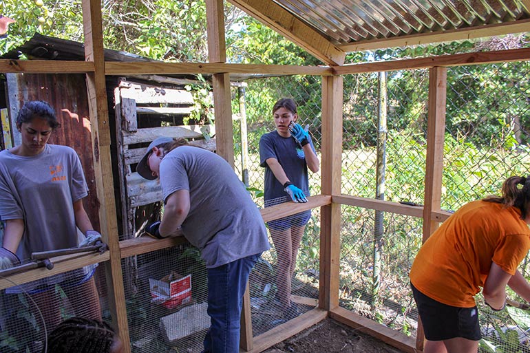 TCE Students Work on Inside Wall of Building in the Dominican Republic