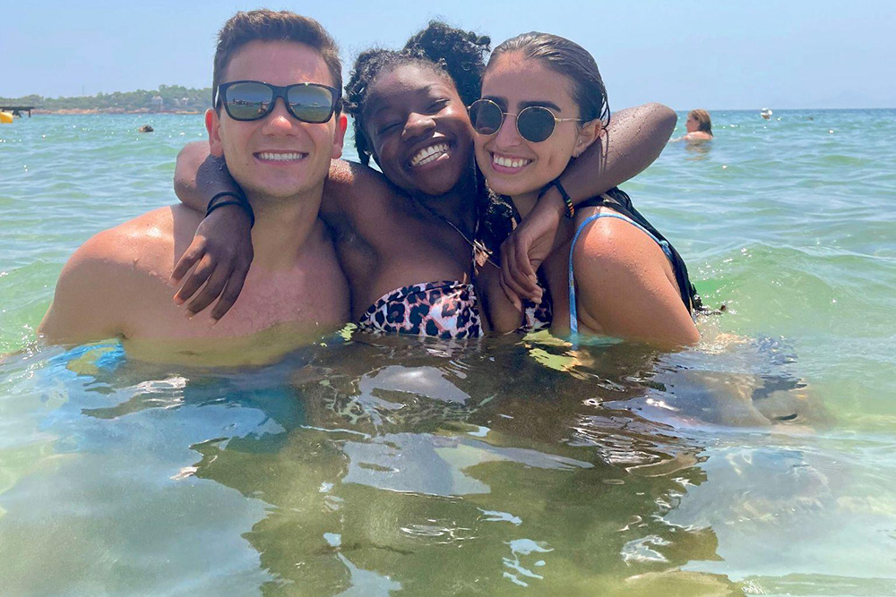 Tasia Gaddis with two friends in the water.
