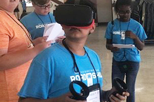 Student uses a virtual reality headset.