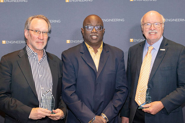 Board of Advisors Chair Cavanaugh Mims, center, presents awards for Appreciation for Outstanding Service to fellow board members John Hanula and Ken Huntsman.
