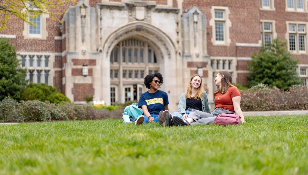 Students sit in front of Ayres Hall