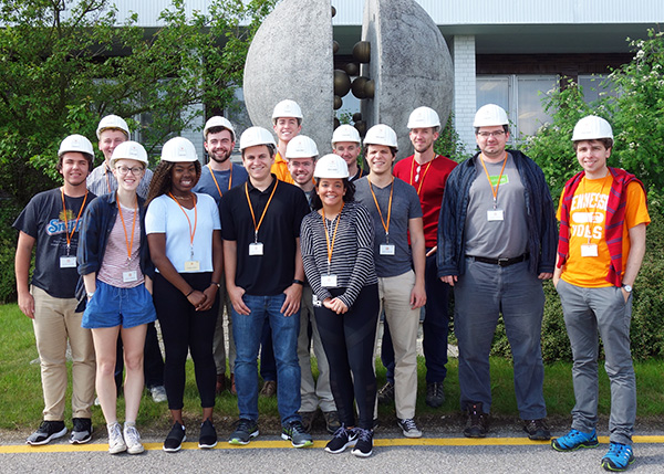 Study abroad group in from of “Fission” statue at the nuclear power plant Temelín.