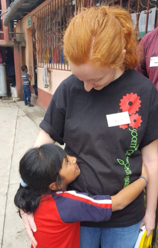 Mary Daffron with a child in Guatemala