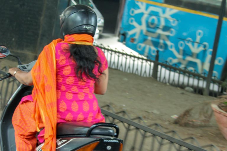 Woman Riding Motorcycle in India