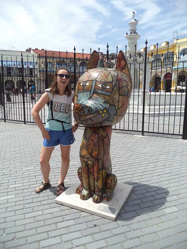 Aubrey Casey with Dog Statue