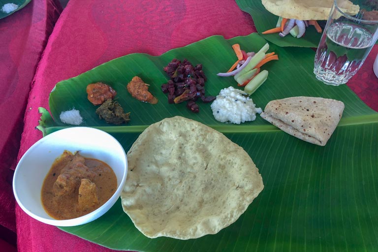 Typical Indian meal served on a banana leaf